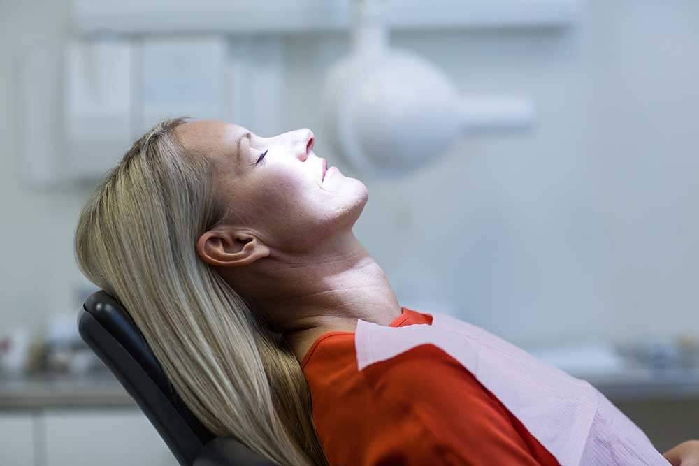 Woman waiting peacefully in a dental chair